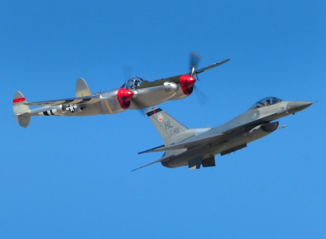 — — - U.S. Air Force heritage flight featuring a General Dynamics F-16 Fighting Falcon and a Lockheed P-38 Lighting in formation saluting the memories of our fallen. Mather field, Capitol Air Show 2012, Rancho Cordova, Ca.,