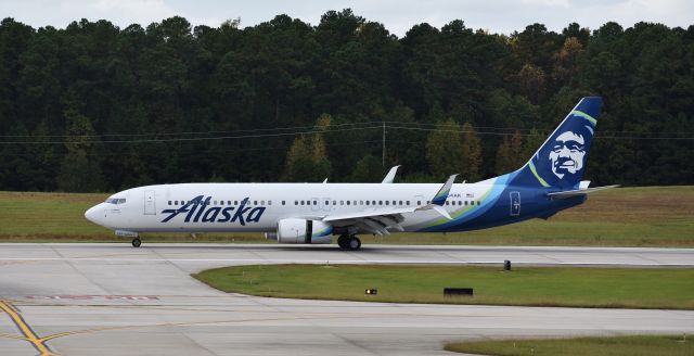 Boeing 737-900 (N264AK) - Chester touching down in RDU from SEA, encountering some pretty Seattle-like weather.