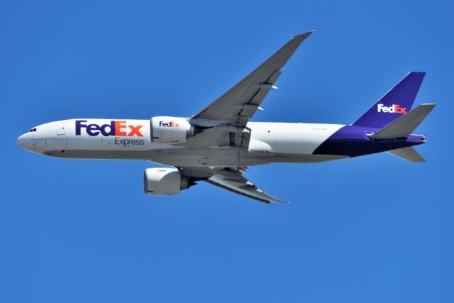 BOEING 777-200LR (N840FD) - Front Porch spotting 03-12-22 @ runway 32 extended final. @3500 agl zoomed in and cropped down.