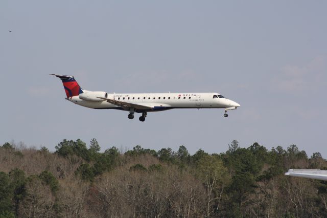 Embraer ERJ-145 (N370SK) - N370SK over the numbers for runway 23L