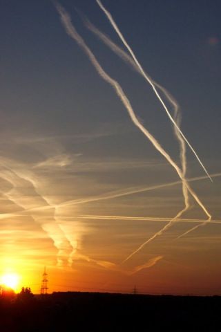 — — - Contrails over Stein, Nürnberg (Bavaria, Germany)..  Nürnberg is a very busy airport at all times of the day.