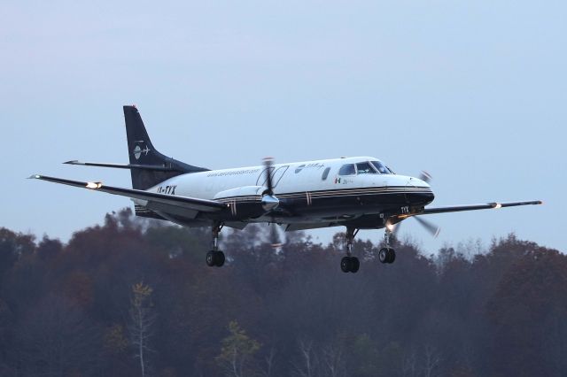 Swearingen Merlin 3 (XA-TYX) - VTM627, a Fairchild Swearingen Metroliner, on short-final for RWY 7 on a cloudy Veterans’ Day morning. 