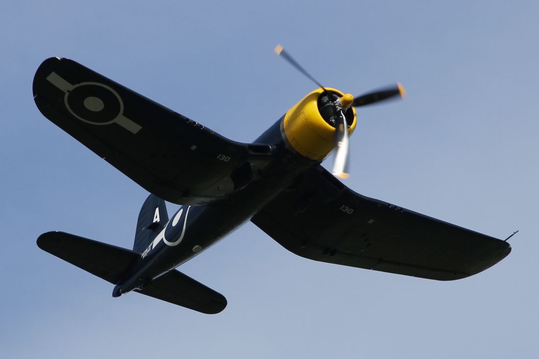 — — - Corsair F4U performs a flypast at Duxford Air Museum.