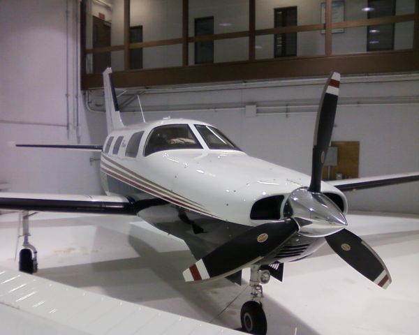 Piper Malibu Mirage (N6079D) - In University of North Dakotas center hanger. Equipped with Avidyne glass cockpit but I couldnt get a good picture through the windows due to reflection of the hanger lights.