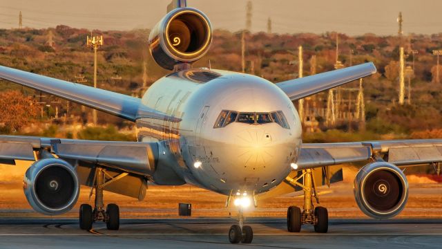 McDonnell Douglas DC-10 (N550FE) - Exiting 31L at Juliet with the last rays of sun for the day.