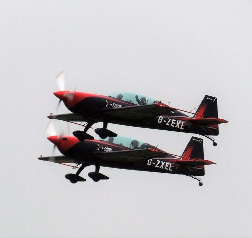 EXTRA EA-300 (G-ZEXL) - Two of The Blades Aerobatics team in perfect harmony at Sywell 6 September 2018