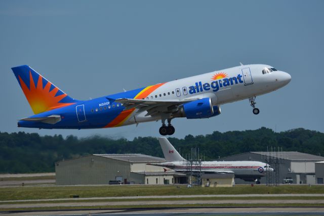 Airbus A319 (N320NV) - Allegiant A319-111 departing runway 20R at Nashville June 14, 2019. Note the Canadian air force Airbus CC-150 Polaris (A310-304) in the background.