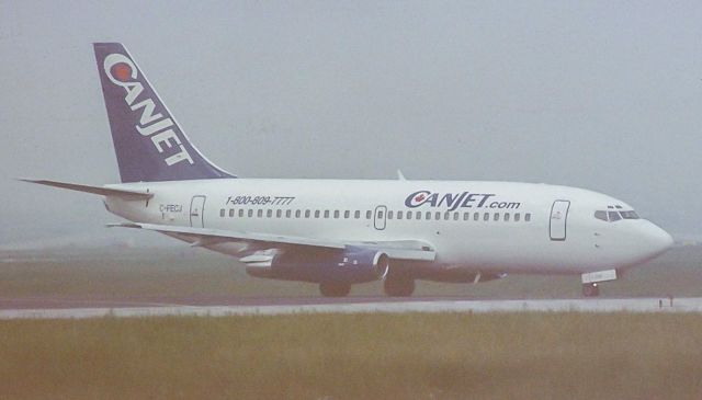 Boeing 737-200 (CFE) - I seemed to have messed up the reg on this one, clearly C-FECJ, a Boeing 737-200 of Canjet holding short of runway 23 at a foggy YYZ. Degraded film shot, sorry for the quality