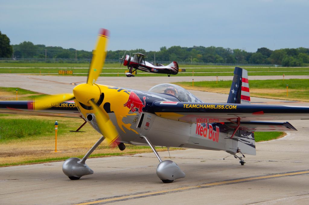 ZIVKO Edge 540 (N423KC) - Kirby Chambliss at the Central Iowa Airshow entertained the audience in his Zivko Edge as part of the Red Bull Air Force.  His performance was awesome and showcased his skills in the aircraft.  Photo taken August 25, 2019 with Nikon D320 at 92mm.