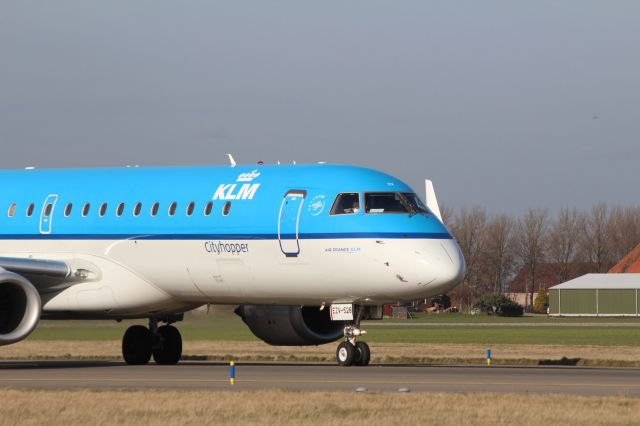 — — - Embraer E190, KLM Cityhopper has landed on the runway and taxiing to the terminal at Schiphol Amsterdam Airport on saturdag, February, 286th. 2015.