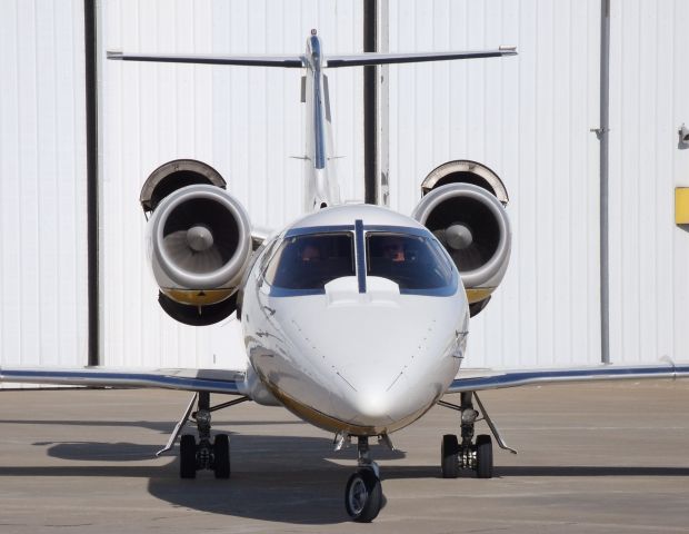 Learjet 60 (N777MC) - Learjet flashing its reverse thrust on the ramp. Please rate this photo, rating is important to me