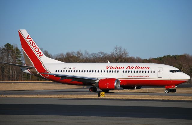 BOEING 737-400 (N732VA) - Taxiing to runway 2. Appear to have added website since last arriving in November. This plane will be based at JQF for the NASCAR season. - 2/14/11