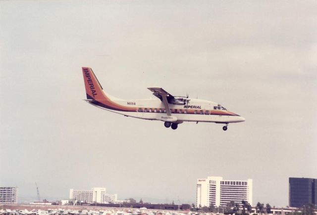 Beechcraft Sundowner (N691A) - Imperial Shorts 360 landing at Santa Ana in the mid-1980s