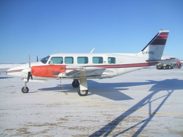 Piper Navajo (C-FVTQ) - Parked at Woodward Aviation FBO Goose Airport NL . March 17/09