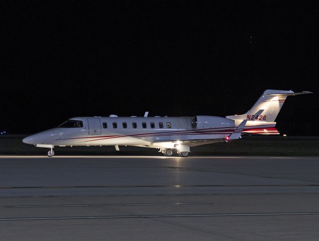 Learjet 45 (N2426) - Trying my hand at some hand-held night photography with the new Canon R6. Caught this local Bombardier Lear45 doing some night takeoff and landings last night, 25 Aug 2022.