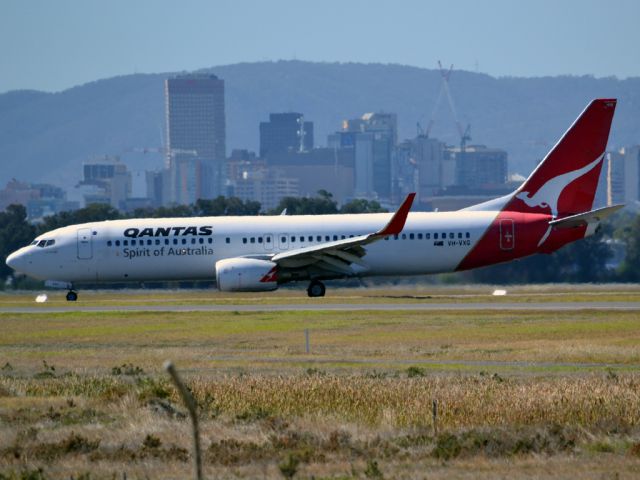 Boeing 737-800 (VH-VXG) - On taxi-way heading for Terminal One, after landing on runway 23. Thursday 12th April 2012.