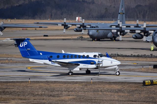 Beechcraft Super King Air 350 (N817UP) - Taxiing in front of WVANG 130th Airlift Wing at Yeager Airport (KCRW)