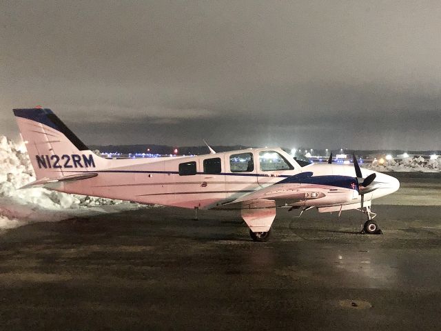 Beechcraft Baron (58) (N122RM) - on the MAC Jets FBO ramp, in Portland, Maine. New Year’s Eve 2021