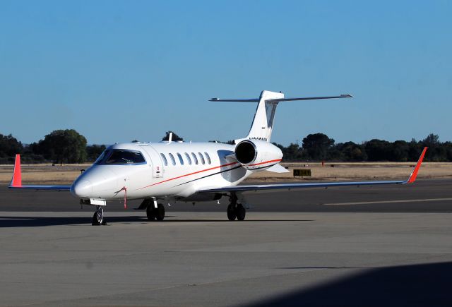 N909MW — - KRDD  I had not seen this Learjet before at RDD, and had to drive around the building to get the reg, unless I typo'd, I could not find the data on 909MW,,and looks like a brand new paint job..love the orange winglets on white overall. 5 Oct 2023.