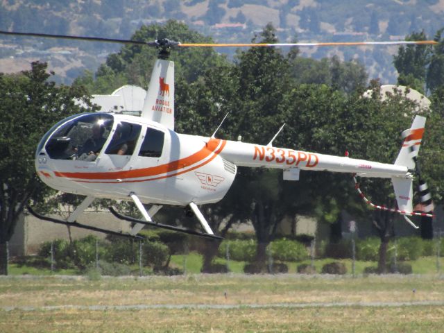 Robinson R-44 (N335PD) - Lifting off from RWY 26L