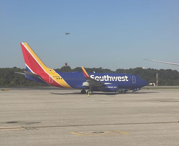 Boeing 737-700 (N565WN) - An airplane takes off in the distance.