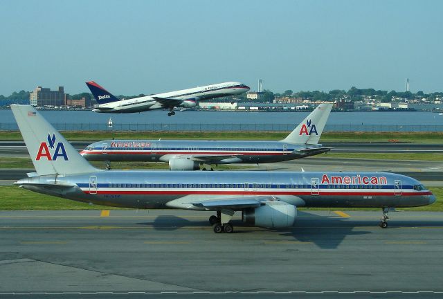 Boeing 757-200 (N636AM) - 757 City at LGA back on May 31, 2006. N636AM is in front of the camera and N610AM is the middle 757. Could not quite make out the reg on the departing ATL bound DL 75, sorry !