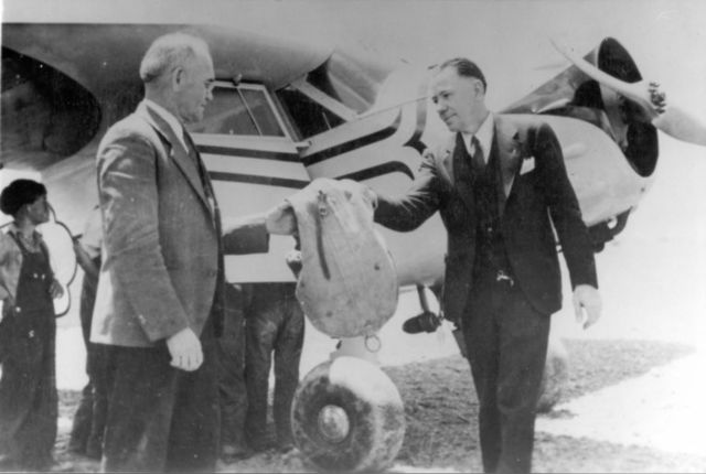 — — - Clint Seal delivering the first airmail to Saint George Utah. 