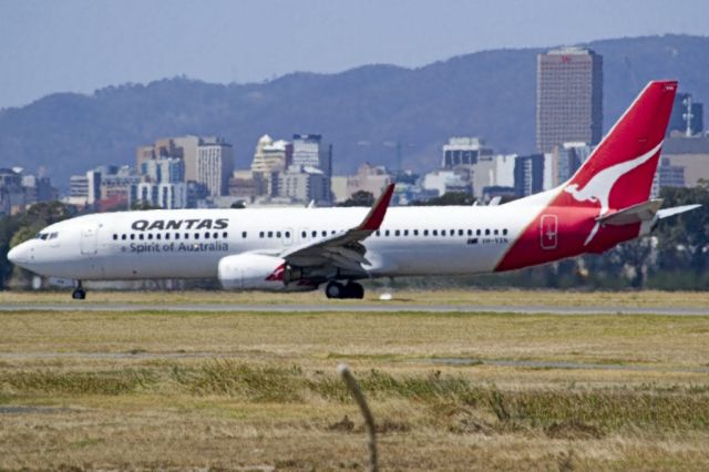 Boeing 737-800 (VH-VXN) - On taxi-way heading to Terminal 1 after landing on runway 23, on the last day of the Australian summer. Thursday 28th February 2013.
