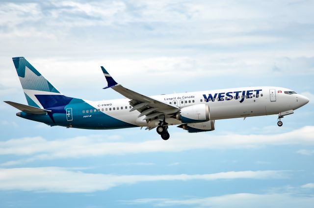 Boeing 737 MAX 8 (C-FNWD) - here is the first Westjet plane in the new livery on final for 23 at Toronto Pearson. Taken on September 4th 2018