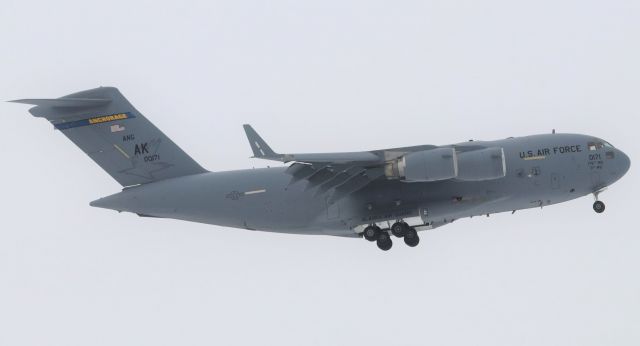 Boeing Globemaster III (00-0171) - C17 “Globemaster” 00-0171 of the 176th Wing, Alaska Air Guard from Joint Base Elmendorf-Richardson in Anchorage, Alaska on short final Rwy 32 at YOW on 21 Mar 23.  Aircraft was inbound from Joint Base Andrews as REACH 3212.br /br /Great looking tail.