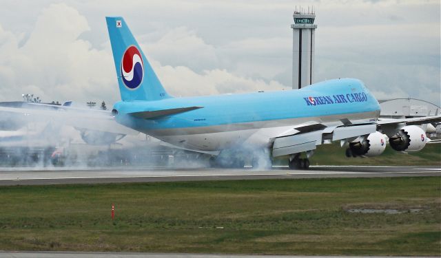 BOEING 747-8 (HL7617) - BOE547 makes tire smoke on landing runway 16R on completion of its maiden flight on 3/15/13. (LN:1474 cn 37654).