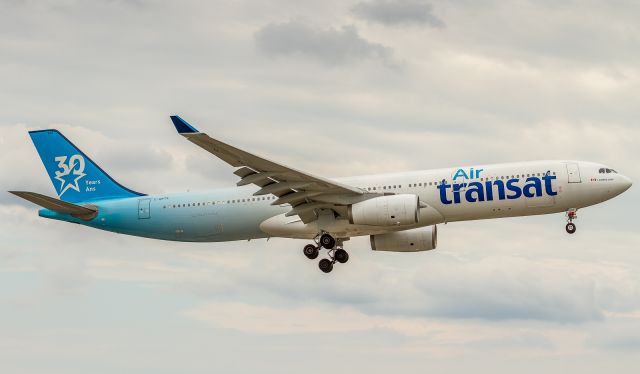 Airbus A330-300 (C-GKTS) - More grey day spotting at YYZ! Here a 30th Anniversary livery for Air Transat is on short finals for runway 24R at YYZ arriving from London Gatwick