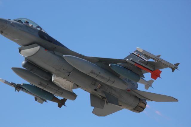 Lockheed F-16 Fighting Falcon — - This F16 from the Colorado National Guard at Buckley AFB was departing runway 14 on its way to bombing practice. It was zipping by me in afterburner at 250+ knots, so I found it difficult to get centered shots.