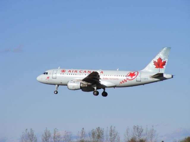 Airbus A319 (C-GBHZ) - Kids Horizon paint scheme,landing on runway#32.
