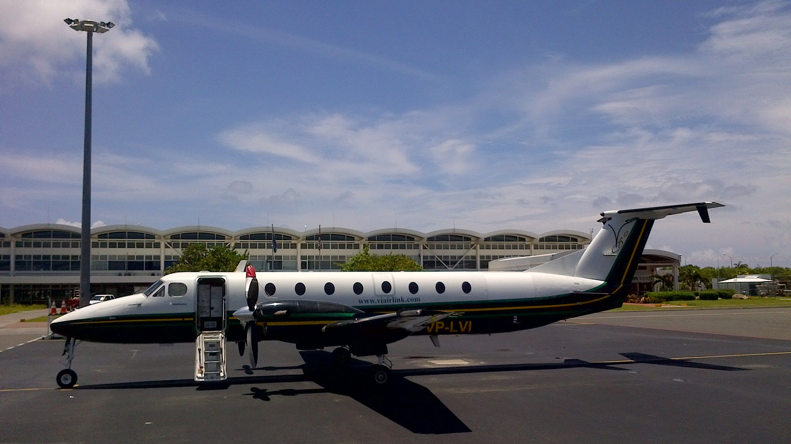 Beechcraft 1900 (VP-LVI) - Left hand view with passenger door open