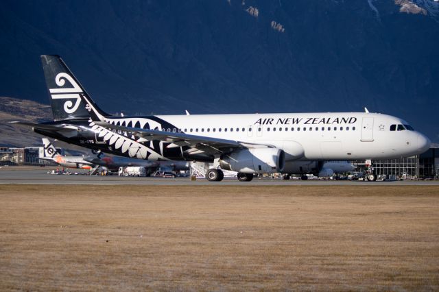 ZK-OXG — - ZK-OXG taxing past with the mountain ranges behind it.