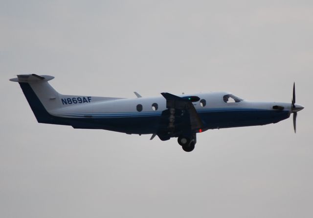 Pilatus PC-12 (N869AF) - DEVCON AVIATION LLC - departing 20L - 2/24/11