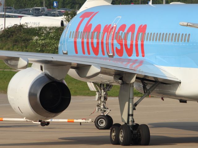 Boeing 757-200 — - A Thompson B757-200 pushes back from the Terminal at Luton Airport.