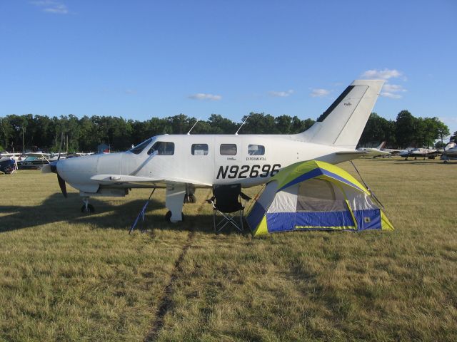 Piper Malibu Mirage (N92696) - Piper Aircraft Experimental Flight Test Aircraft Pictured camping at OSH during a service test.