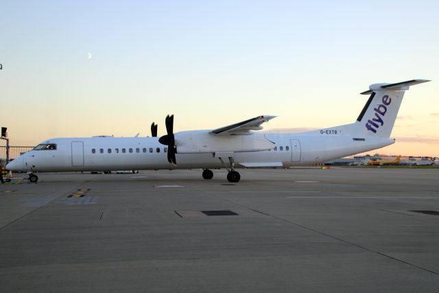 de Havilland Dash 8-400 (G-EXTB) - Parked on Stand 253R on 2-Oct-22 prior to operating flight BEE974 to EGAC.