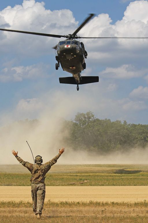 Sikorsky S-70 (9026307) - A USAF Special Operations Combat Control Specialist (CCT) guides a US Army National Guard MedEvac (90-26307, c/n 701552) in during a “DUSTOFF” sortie during Warrior Exercise 86-13-01 (WAREX) on 17 Jul 2013.