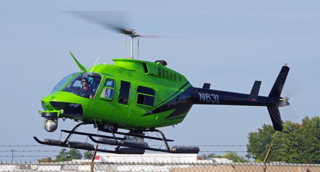 Bell JetRanger (N63L) - LINDEN AIRPORT-LINDEN, NEW JERSEY, USA-OCTOBER 12, 2022: A helicopter owned by Helicopters, Inc was seen by RF taking off shortly after refueling at Linden Airport. Notice the smile on the pilot's face.