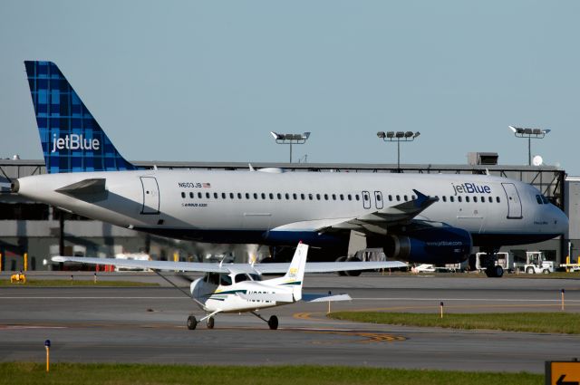 Airbus A320 (N603JB) - Airbus meets Cessna. At Syracuse NY.