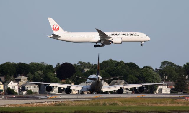 Boeing 787-9 Dreamliner (JA863J) - 2 of Boeings newer aircraft - JAL B789 Dreamliner arriving while Lufthansa B748 looks on before departing. 