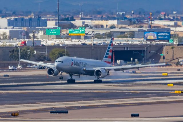 Boeing 777-200 (N779AN) - An American Airlines 777-200 landing at PHX on 2/13/23, the busiest day in PHX history, during the Super Bowl rush. Taken with a Canon R7 and Canon EF 100-400 II L lens.