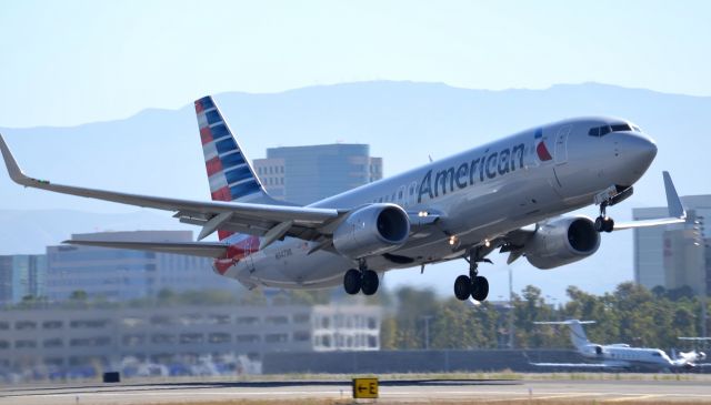 Boeing 737-800 (N947NN) - N947NN seen taking off from runway 20R on a sunny day in socal which is very nice change from the cloudy weather weve been having lately.