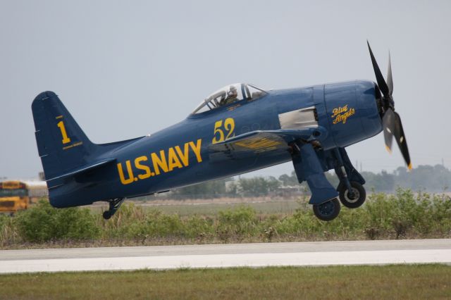 Cessna Citation CJ1 (N68RW) - F8F Bearcat performs during the 2012 Florida International Airshow