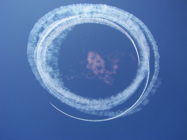 — — - MCAS Miramar Airshow 2007  San Diego, CA  Retired Red Baron Pizza team circles around an Army jumper!