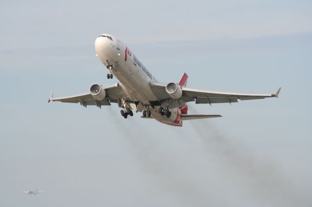 Boeing MD-11 — - Martinair MD-11 rocketing off of KMIAs runway 27. Note American Airlines Boeing 757-200 on short final in the bottom-left of the image. Go to large or full view for best quality.