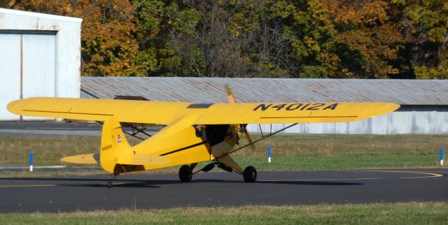 Piper NE Cub (N4012A) - Taxiing to parking is this 1943 Piper J3C-65 Cub in the Autumn of 2022. NE refers to it's US Navy designation from long ago.